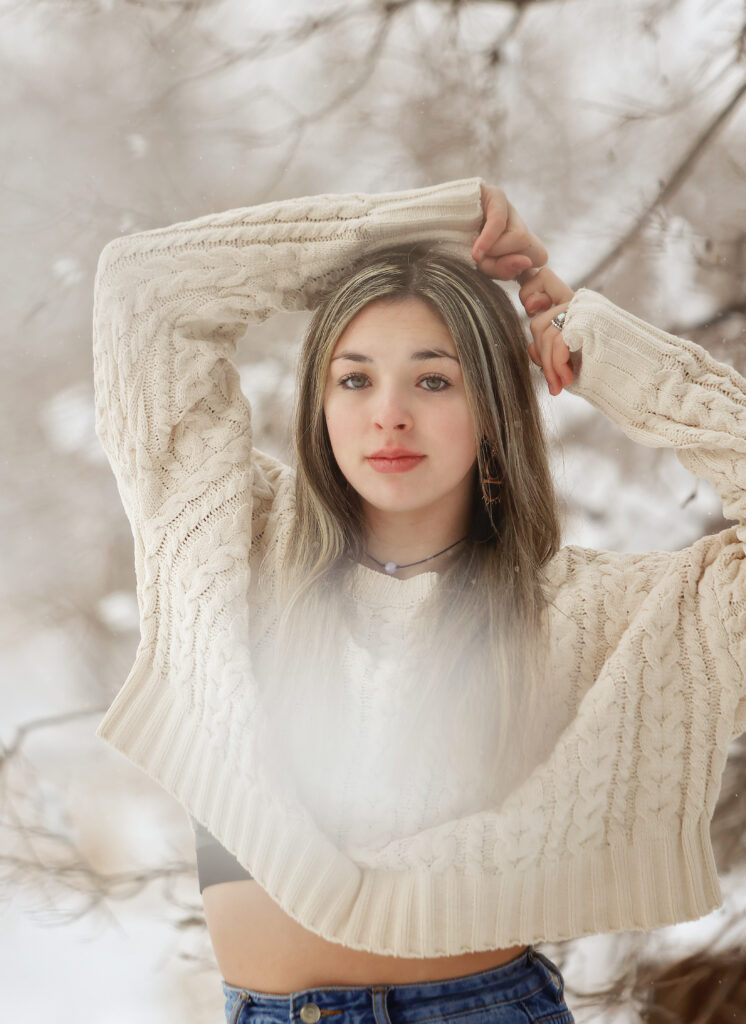Senior girl standing in the snow in tulia Tx 