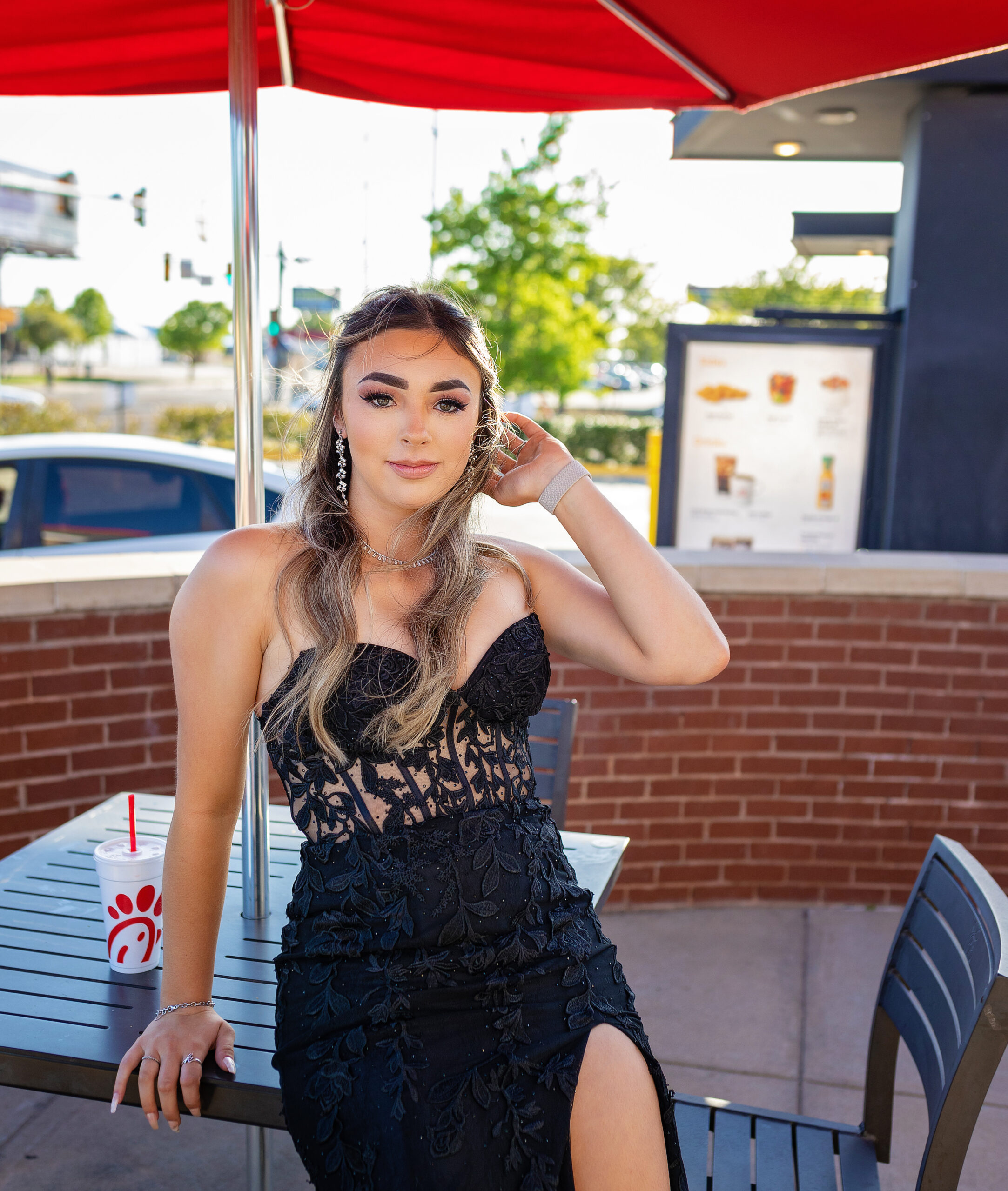 High school senior dressed up at Chick-fil-A to have dinner before prom